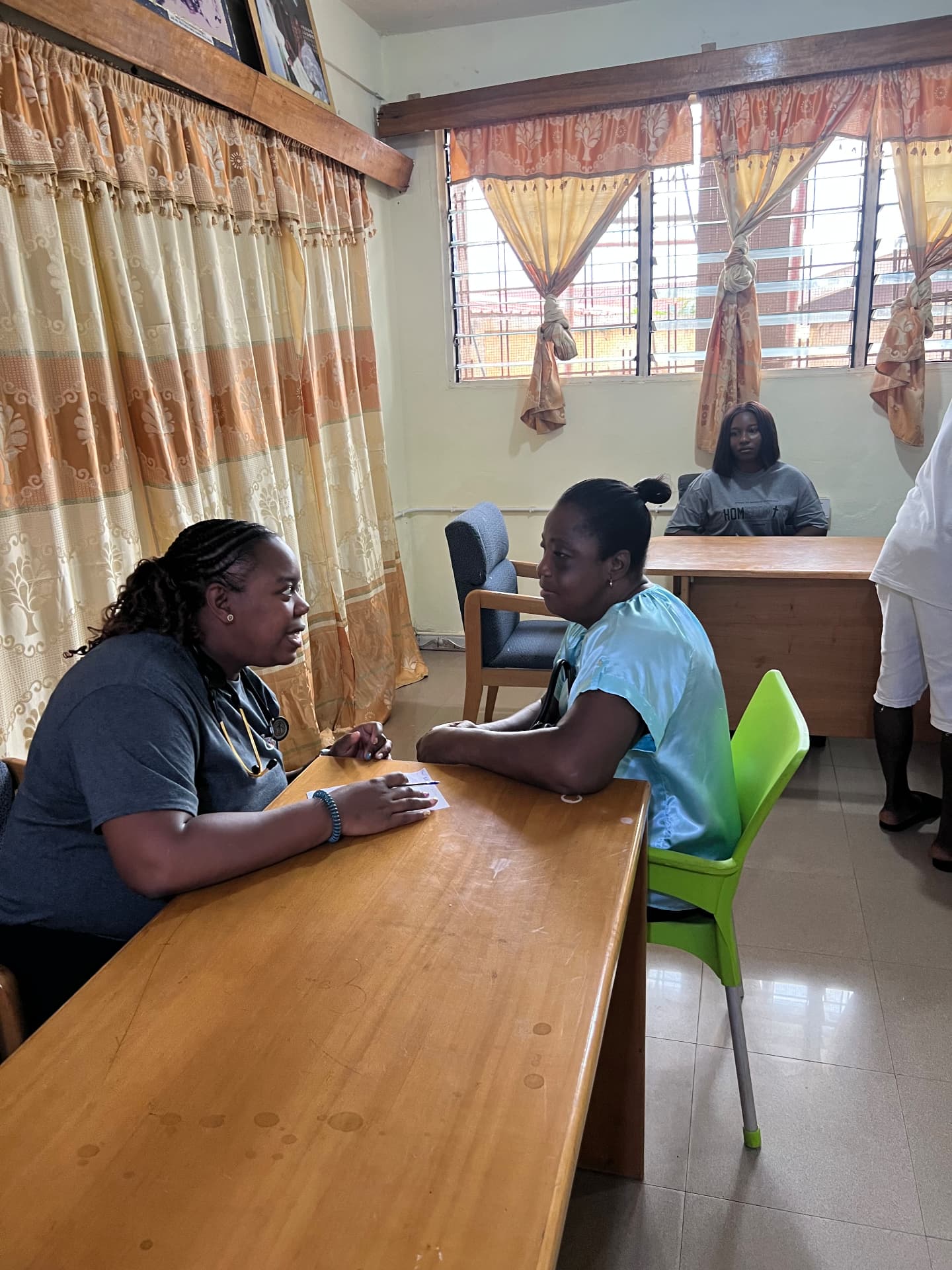 A one-on-one health consultation during the Ghana medical screening event